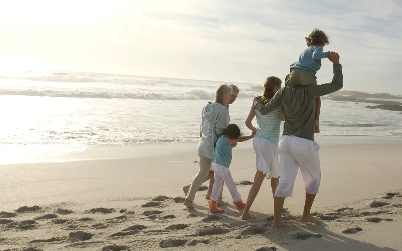 Family walking on the beach