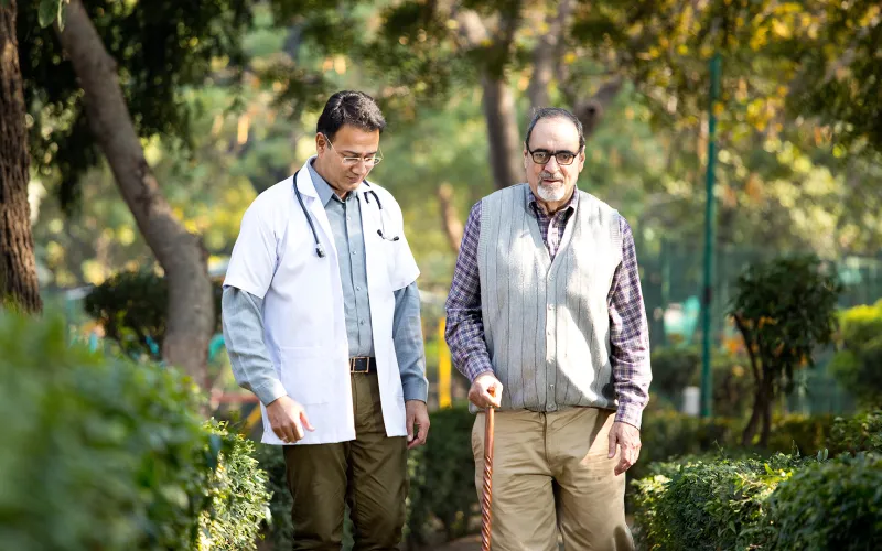 Man walking with his doctor