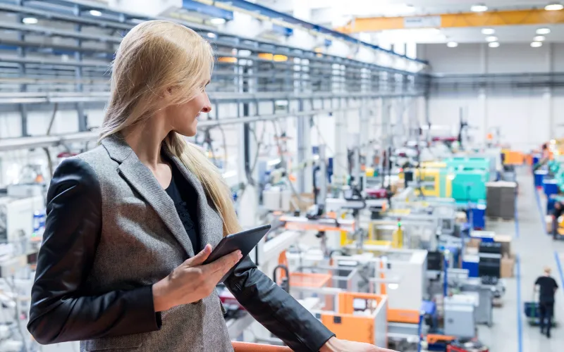 Business woman overlooking a large workspace