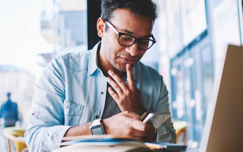 Man researching online trading platforms