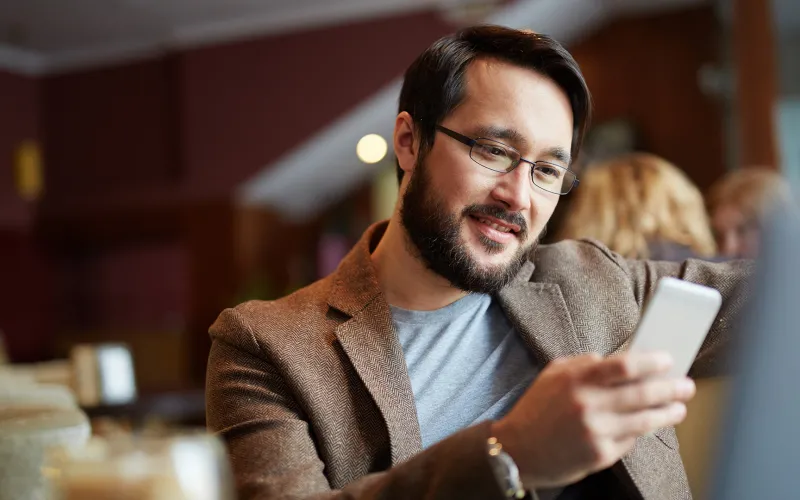 Man checking investments on his smartphone