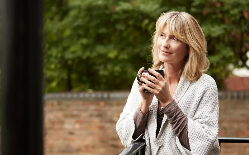 Woman holding a cup of coffee