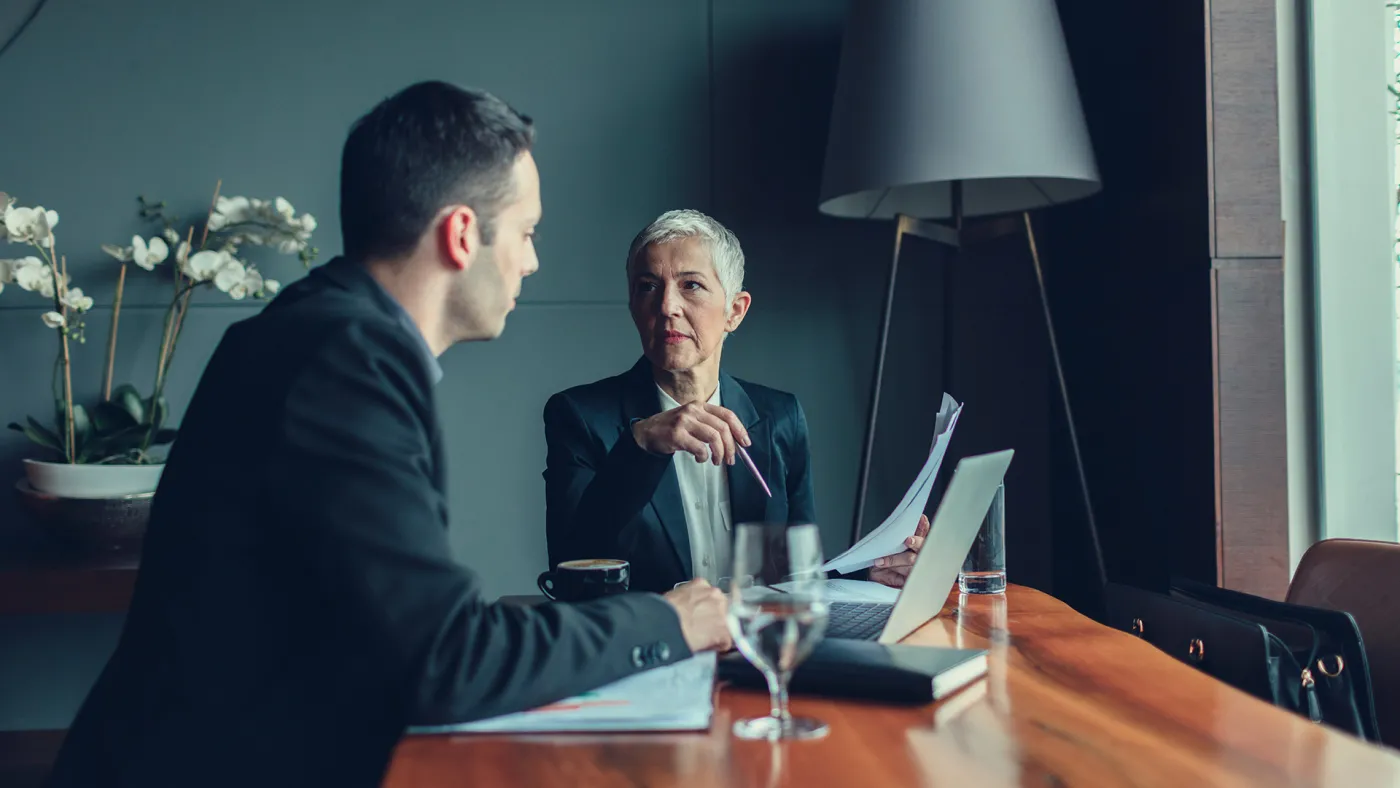 Man and woman having business discussion