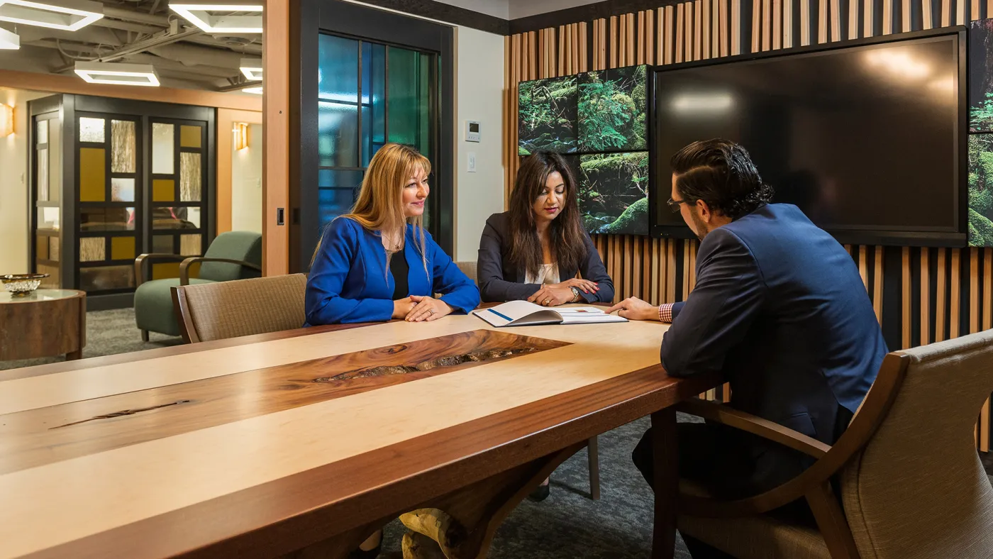 Clients meeting with their financial advisor