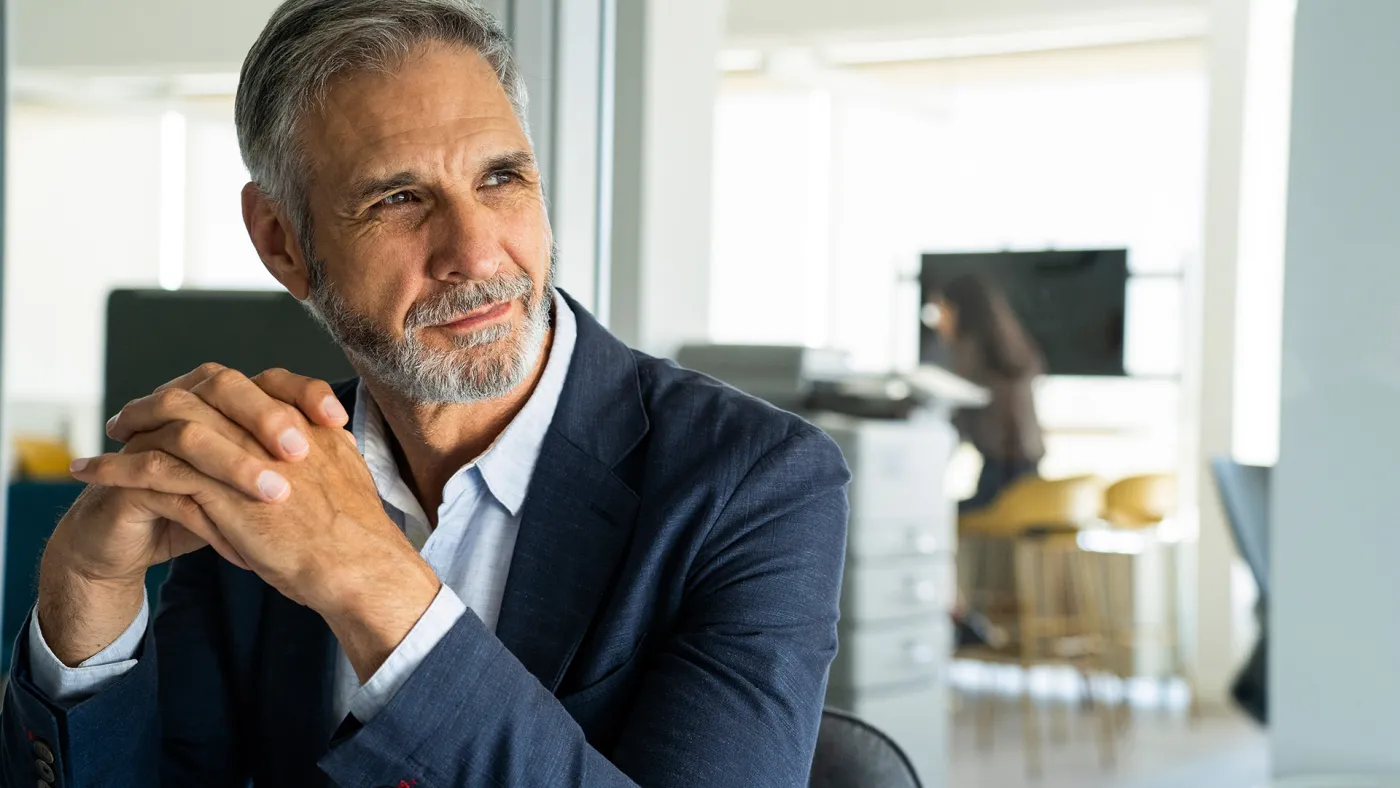 Man at desk thinking