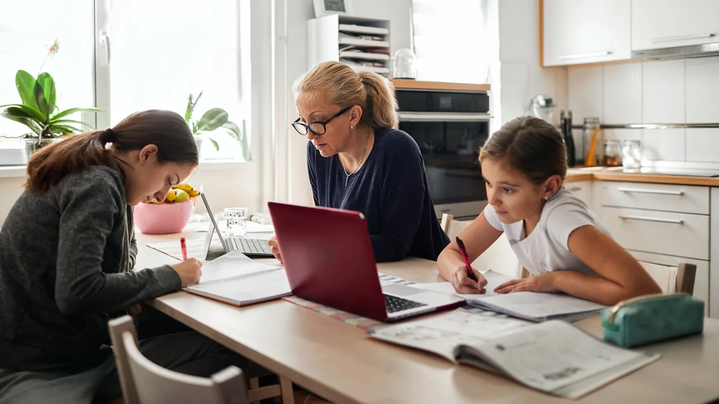 Kids studying with mom