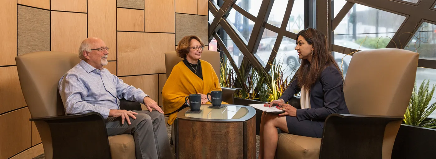 Couple speaking with an advisor in a BlueShore branch