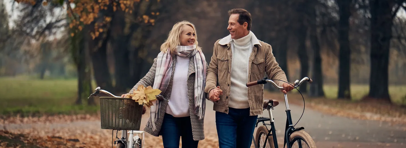 Couple out for a bike ride in fall