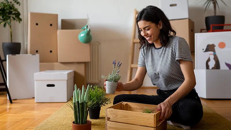 Women unpacking house plants