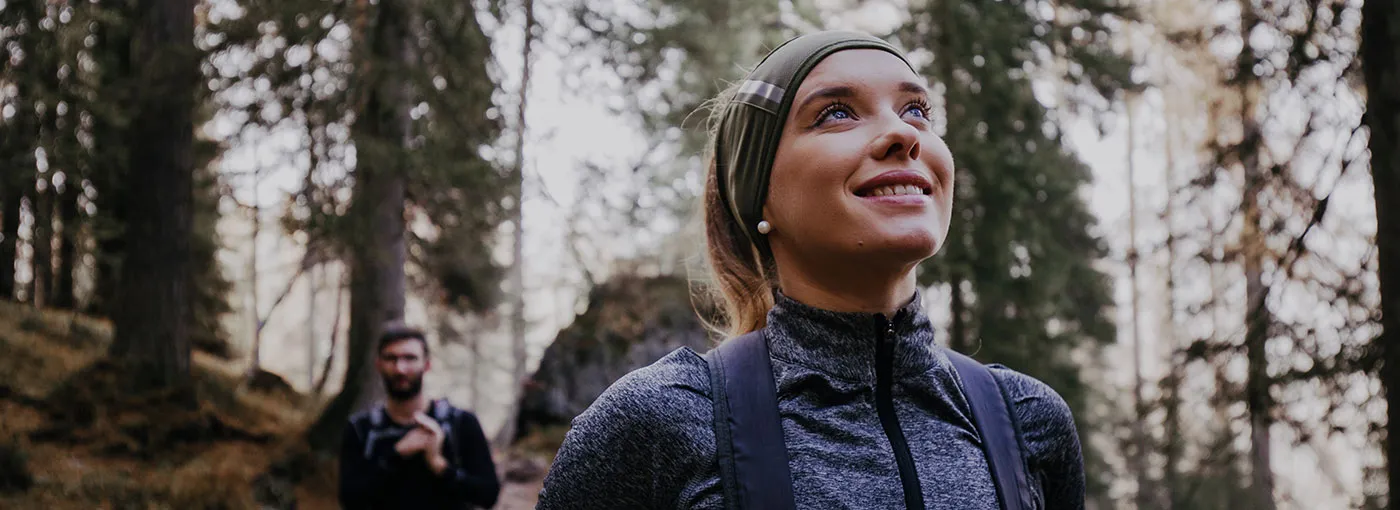 Woman hiking with a man on a local trail