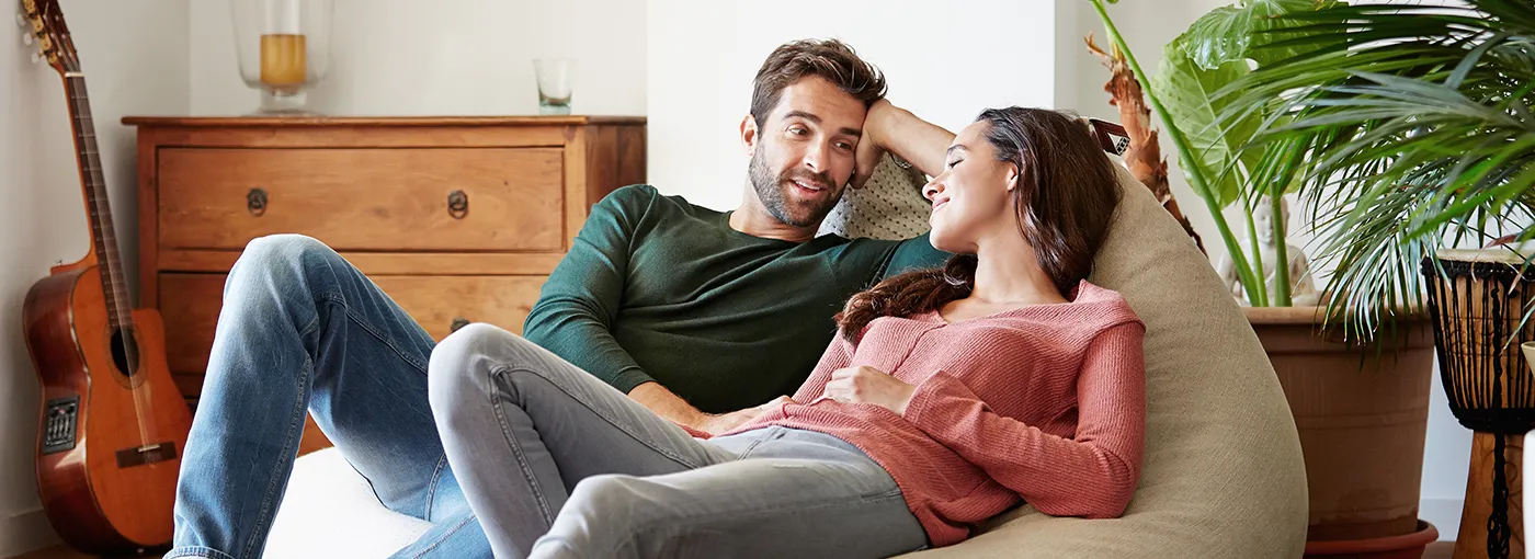 A couple talking to each other in their home