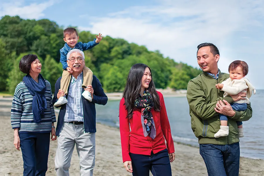 A family exploring the shoreline in British Columbia.