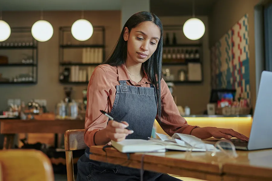 A woman working in a cafe.