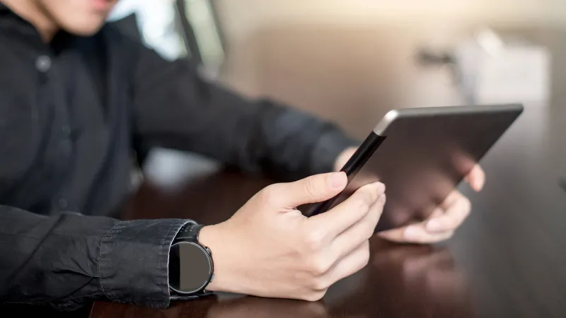 Man reading a tablet