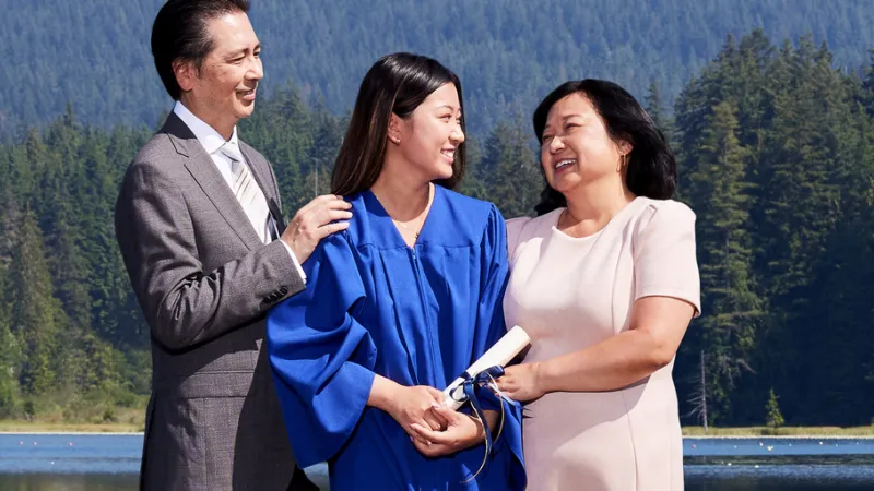 Graduation scene showing a family.